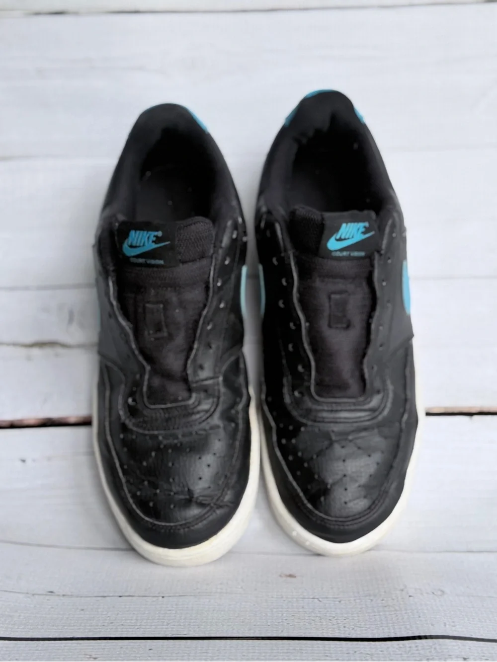 Nike Men’s Black Sneakers with Blue Swoosh